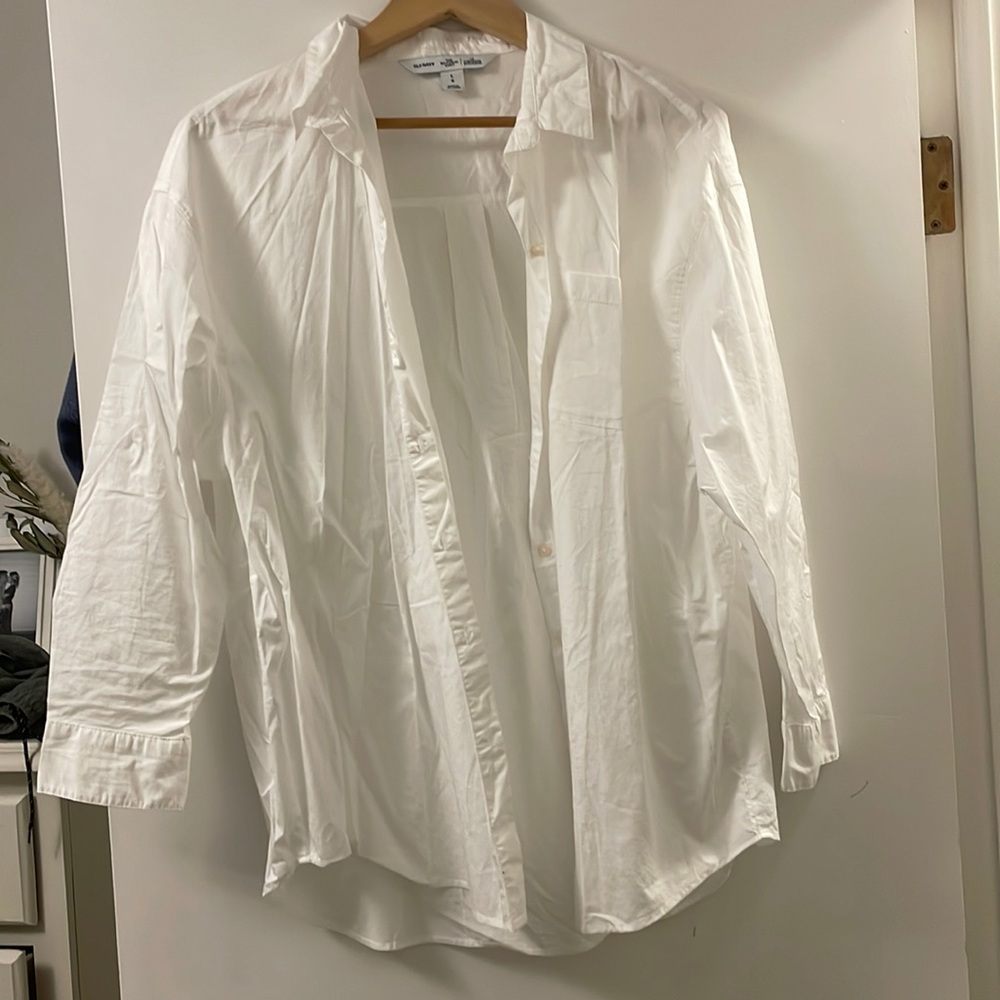 Boyfriend style white shirt. Button up. Size large. Never worn, without tags.